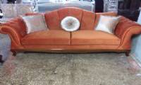 coral velvet chesterfield sofa and silver pillows