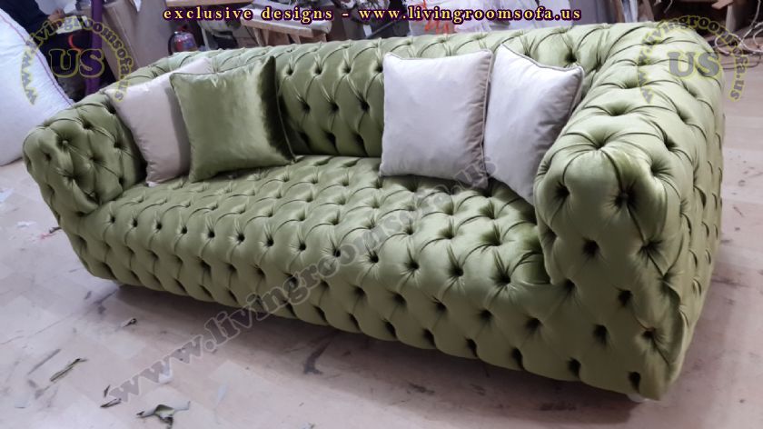 green fabric chesterfield sofa